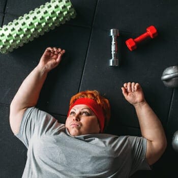 Woman resting from exhaustion during exercise