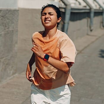 Woman doing sprint jogs outdoors