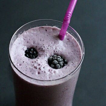 A fiber provider smoothie with frozen berries on top