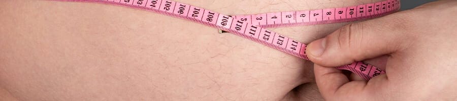 Measuring a round belly with a measuring tape