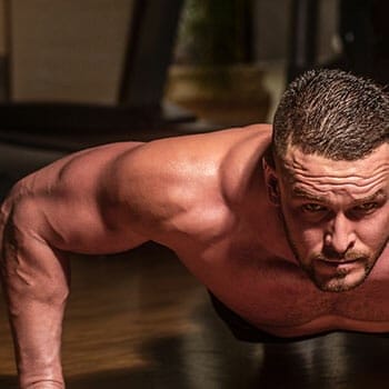 shirtless man working out