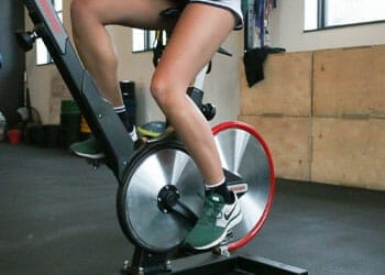leg view of a woman using an elliptical
