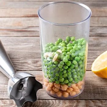 green peas filling a plastic jar