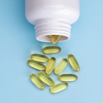 bottle spilling fish oil supplements
