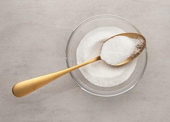white powder on a spoon and bowl