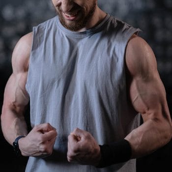 man showing off his arm muscles