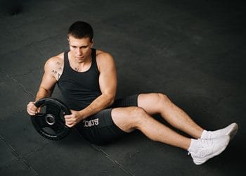man in a russian twist position