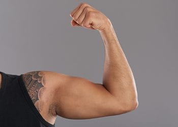 man flexing his arms