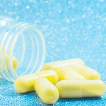 yellow capsules in a jar