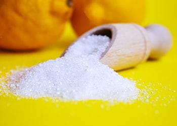 lemon and white powder in spoon