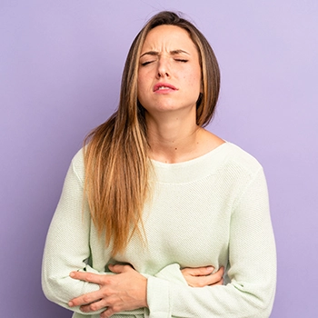 A woman having an upset stomach