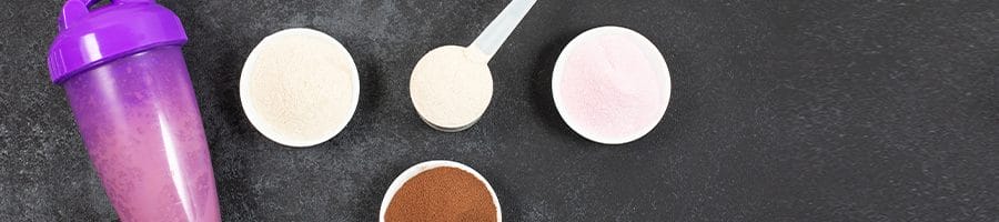 variety of protein powders in cups