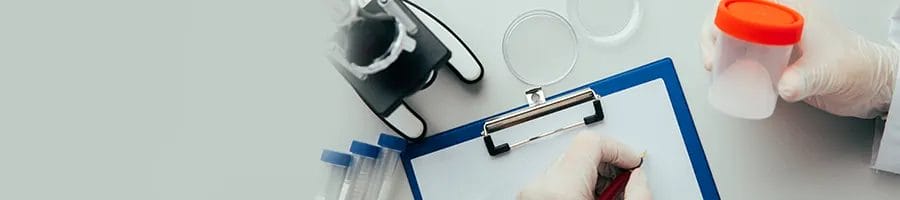 hand view of a person examining a sample