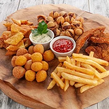 fried food in a platter with sauces