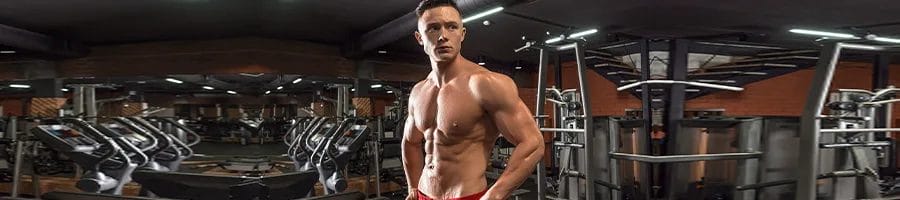 shirtless man with abs at the gym
