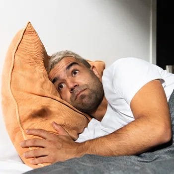 confused man on a pillow