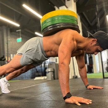man doing planks with weights