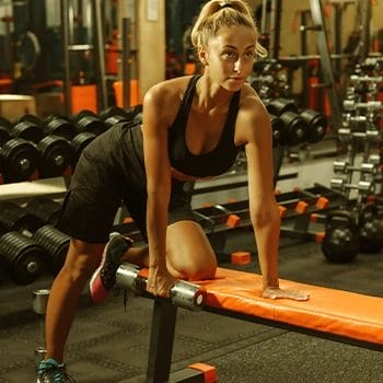 woman in a bent over row position