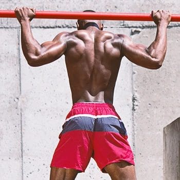 A man doing pull ups on a bar