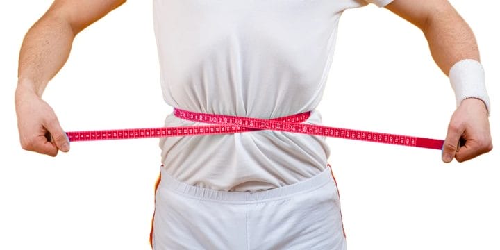 Squeezing measuring tape around body