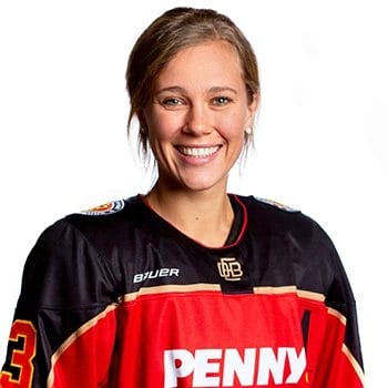 Hockey player smiling in front of the camera