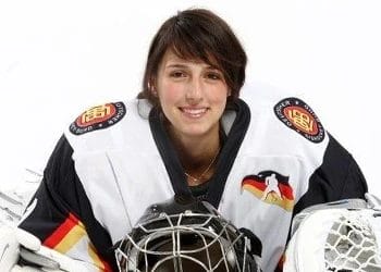 Female hockey player smiling