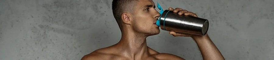 Muscular person drinking