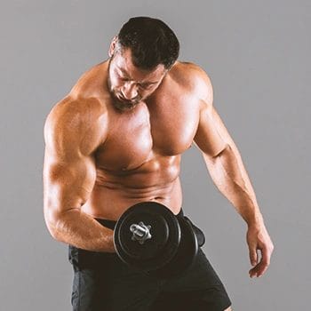 A muscular man lifting a dumbbell