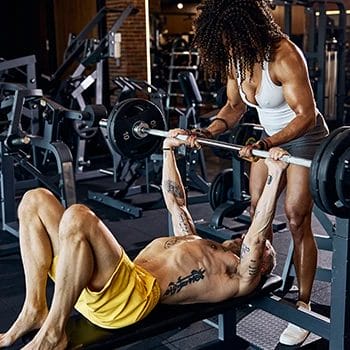 Barbell lifting with personal trainer