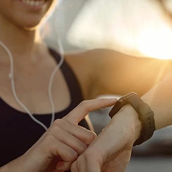Using her watch to time her steps