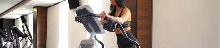 A woman using a stairmaster machine
