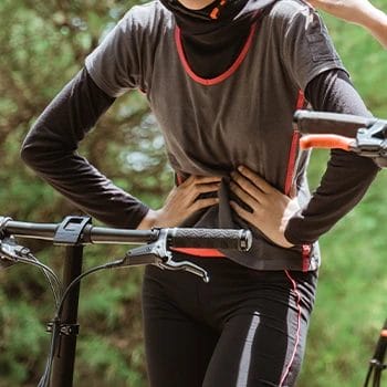 A cyclist with an upset stomach