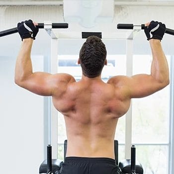 Man with great back muscles performing pull ups