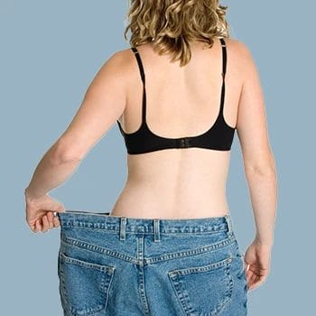 A woman wearing a wide pants showing her weight loss
