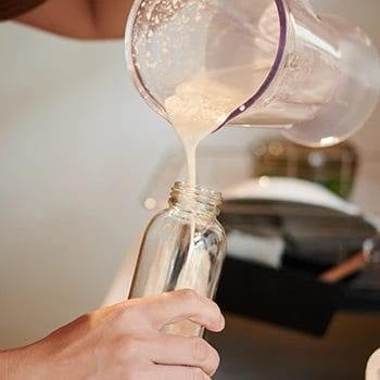 Pouring protein shake from a blender