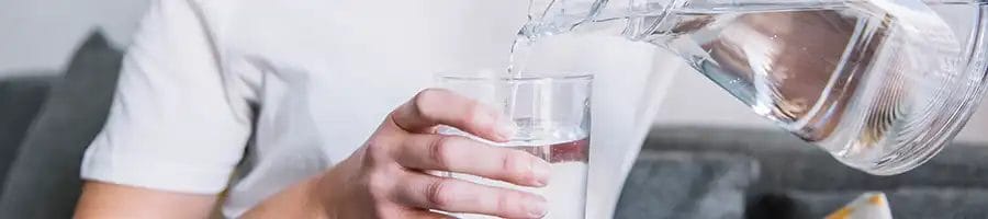 Pouring water in a clean glass