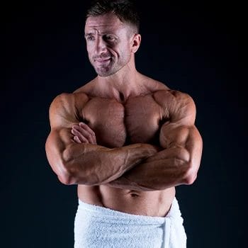 A muscular person wearing a towel
