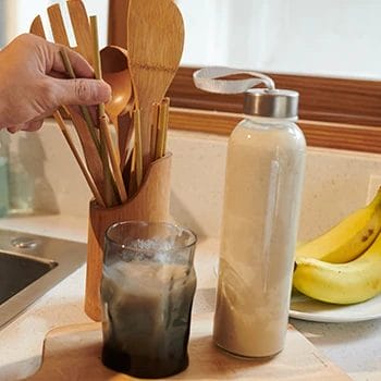 Making a protein shake in the kitchen
