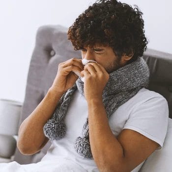 A sick person sneezing