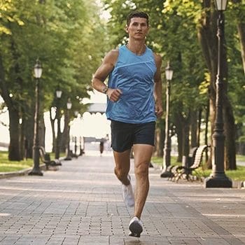 A person jogging outside in the park