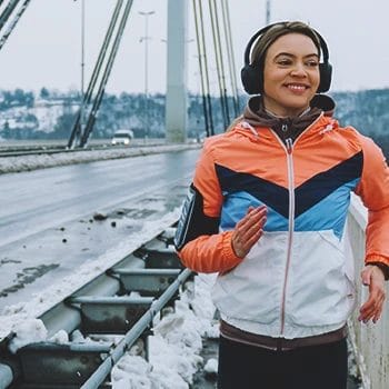 A person jogging outside in the winter