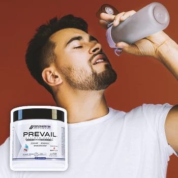 Prevail Pre-workout with a person in the background drinking from a tumler