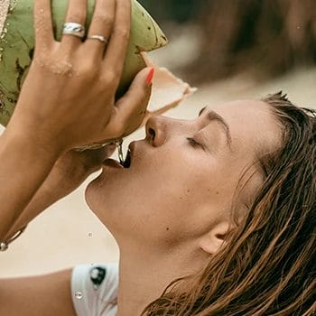 Drinking fresh coconut water