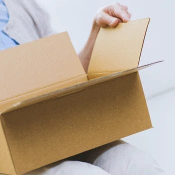 A person opening a box