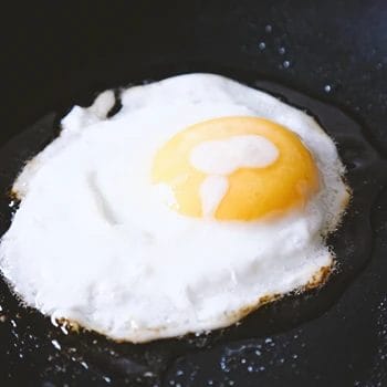 Close up shot of cooked eggs on a pan
