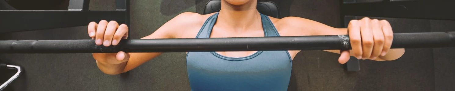 Close up shot of a woman lifting weights