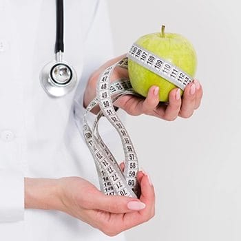 Diet concept using apple and measuring tape