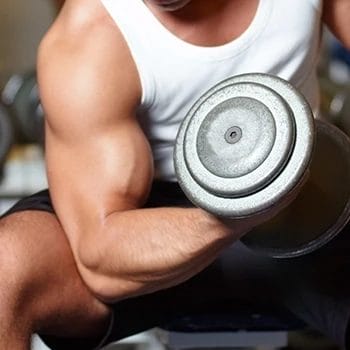 Close up image of lifting a dumbbell showing biceps