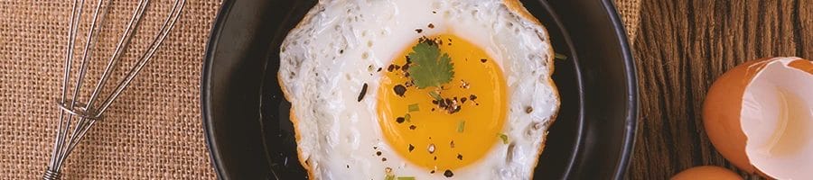 Top view of eggs on a pan that boosts testosterone