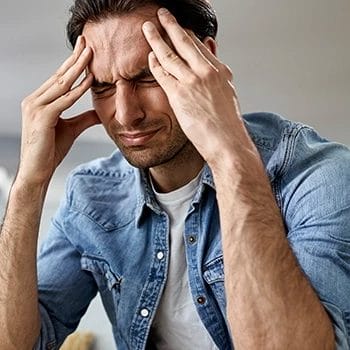 Emotional individual holding himself together